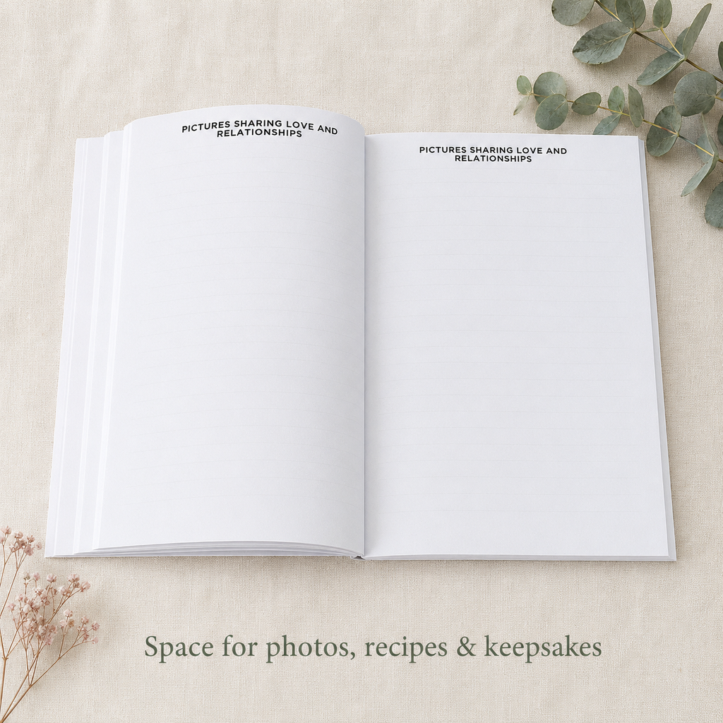 An open white keepsake book or journal laid flat on a light beige fabric surface, with printed text at the top of both pages reading 'PICTURES SHARING LOVE AND RELATIONSHIPS.' Decorative dried flowers and eucalyptus leaves are placed around it, and text at the bottom says 'Space for photos, recipes & keepsakes.